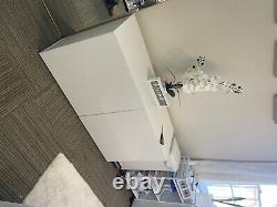 White storage cabinet. Reception desk and other furnitures